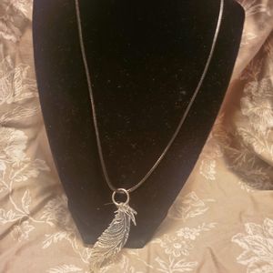 Clear resin feather pendant handmade